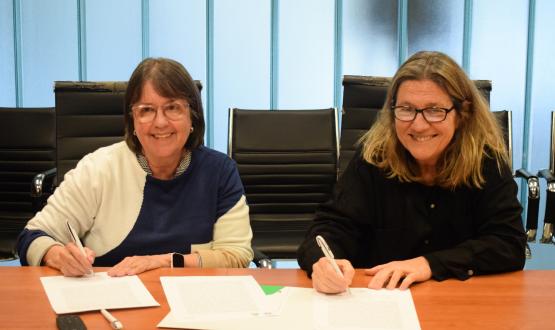 Gladys Ceretta y Silvana Pissano firman acuerdo de cooperación.